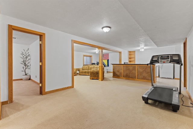 4315 129th St, Urbandale, IA 50323 - workout area with carpet floors, built in features, and a textured ceiling