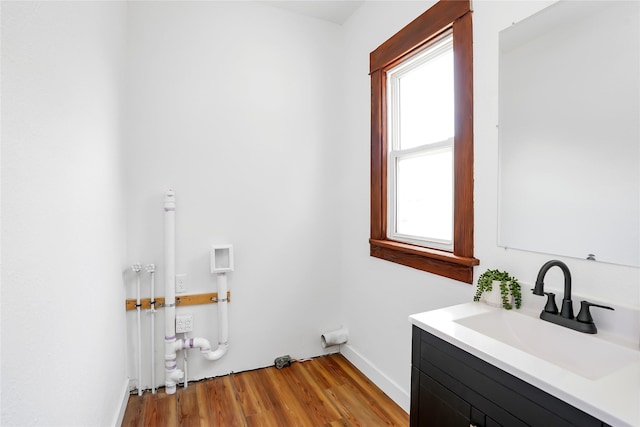 403 E 2nd St S, Newton, IA 50208 - laundry room featuring hookup for a washing machine and light wood-style floors