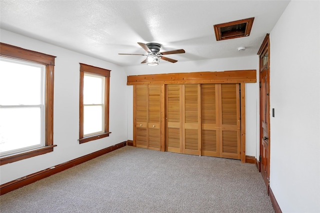 403 E 2nd St S, Newton, IA 50208 - unfurnished bedroom featuring carpet and a ceiling fan