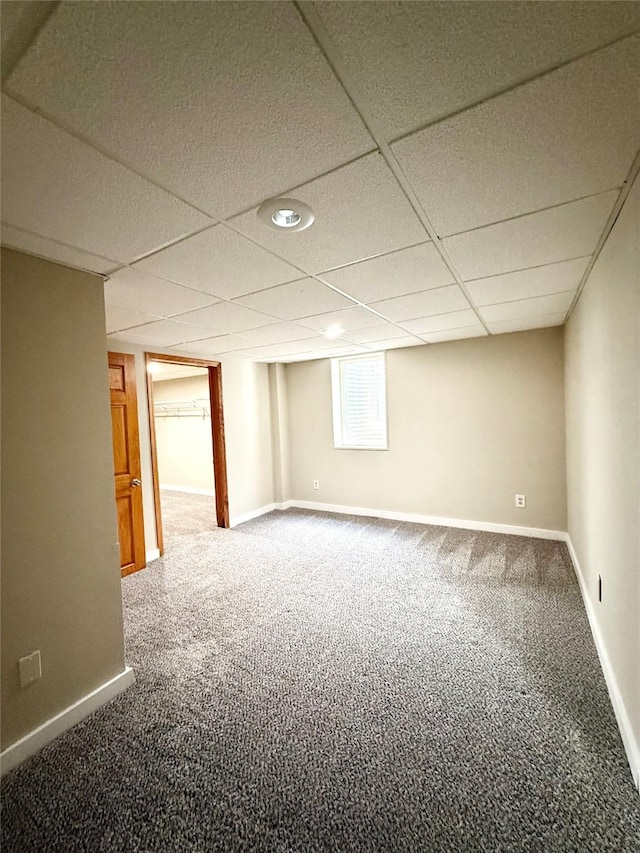 3355 Kinsey Ave, Des Moines, IA 50317 - below grade area with carpet flooring and a paneled ceiling