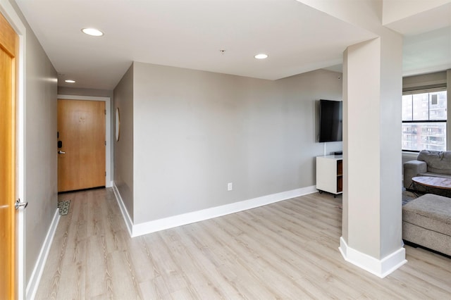 400 Walnut St Unit 901, Des Moines, IA 50309 - unfurnished living room featuring light wood-style flooring and recessed lighting