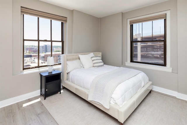 400 Walnut St Unit 901, Des Moines, IA 50309 - bedroom with wood finished floors and baseboards