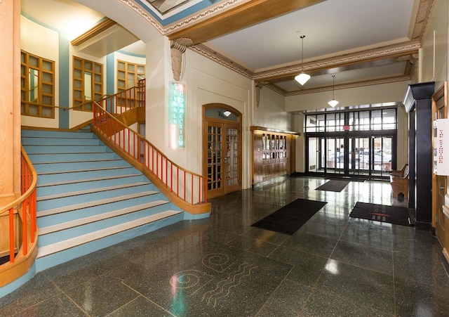 400 Walnut St Unit 901, Des Moines, IA 50309 - community lobby with a towering ceiling, ornamental molding, and stairway