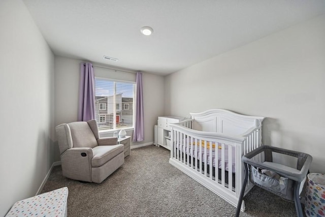 9529 Capstone Ct, West Des Moines, IA 50266 - bedroom featuring carpet flooring and a crib