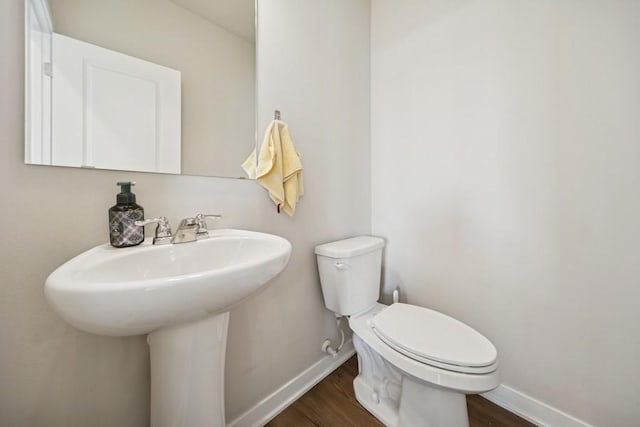 9529 Capstone Ct, West Des Moines, IA 50266 - half bath with baseboards and wood finished floors