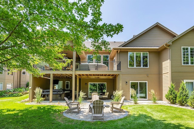 1286 Glen Oaks Dr, West Des Moines, IA 50266 - back of property with a hot tub, a patio, a lawn, and a balcony