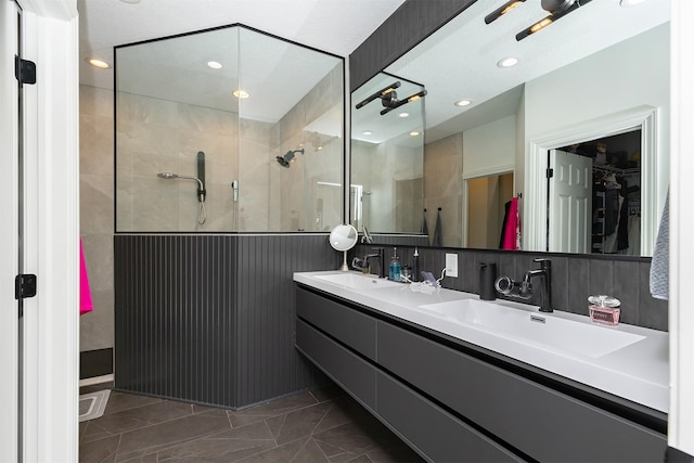1286 Glen Oaks Dr, West Des Moines, IA 50266 - full bath featuring a walk in closet, a stall shower, double vanity, and recessed lighting