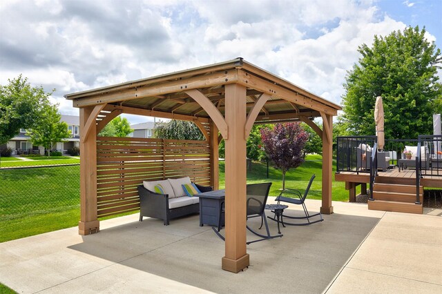 690 SE Driftwood Ln, Waukee, IA 50263 - view of patio with a wooden deck, a gazebo, outdoor lounge area, and outdoor dining space