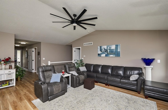 690 SE Driftwood Ln, Waukee, IA 50263 - living room featuring a ceiling fan, wood finished floors, and vaulted ceiling