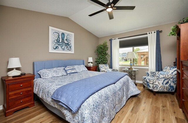 690 SE Driftwood Ln, Waukee, IA 50263 - bedroom with light wood-style floors, vaulted ceiling, and ceiling fan
