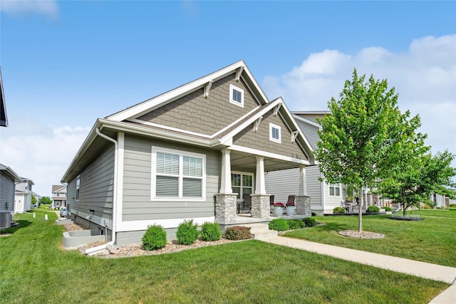 523 S Bluestone Way W, Des Moines, IA 50266 - craftsman house featuring a porch and a front yard