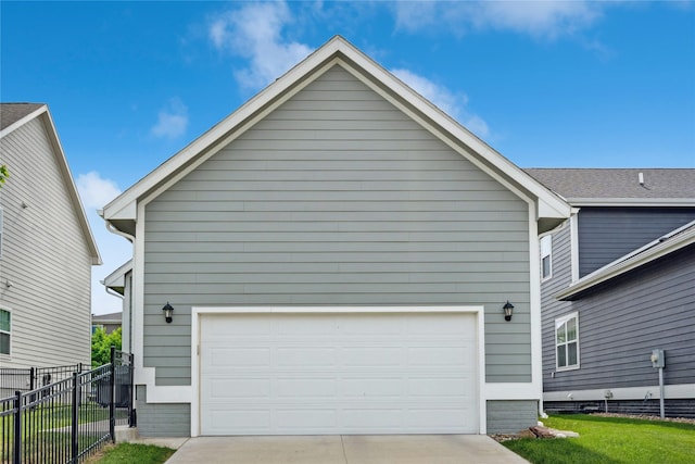 523 S Bluestone Way W, Des Moines, IA 50266 - view of home's exterior with a garage and concrete driveway