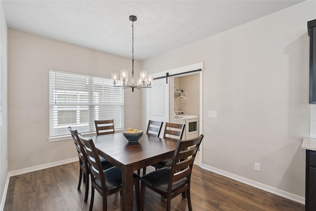 523 S Bluestone Way W, Des Moines, IA 50266 - dining area featuring dark wood-type flooring, a barn door, a chandelier, and independent washer and dryer