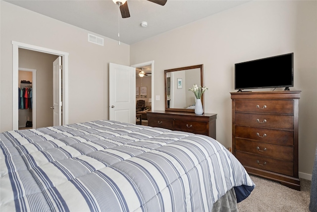 523 S Bluestone Way W, Des Moines, IA 50266 - bedroom featuring carpet flooring, a walk in closet, and a ceiling fan