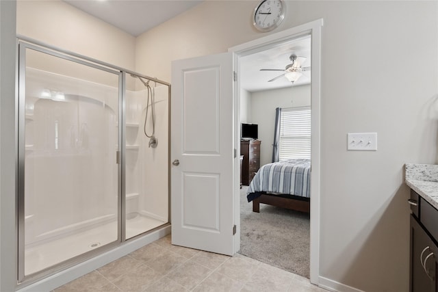523 S Bluestone Way W, Des Moines, IA 50266 - full bath featuring a shower stall, vanity, tile patterned flooring, a ceiling fan, and ensuite bath