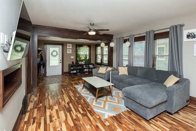 1346 48th St, Des Moines, IA 50311 - living area with wood finished floors and ceiling fan