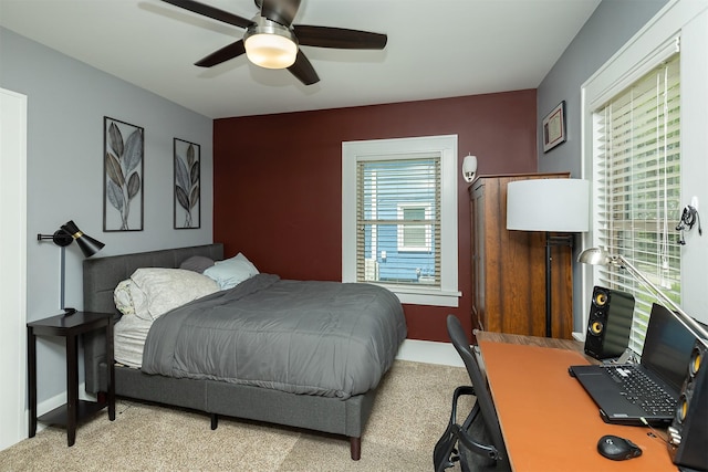 1346 48th St, Des Moines, IA 50311 - carpeted bedroom with an office area and ceiling fan