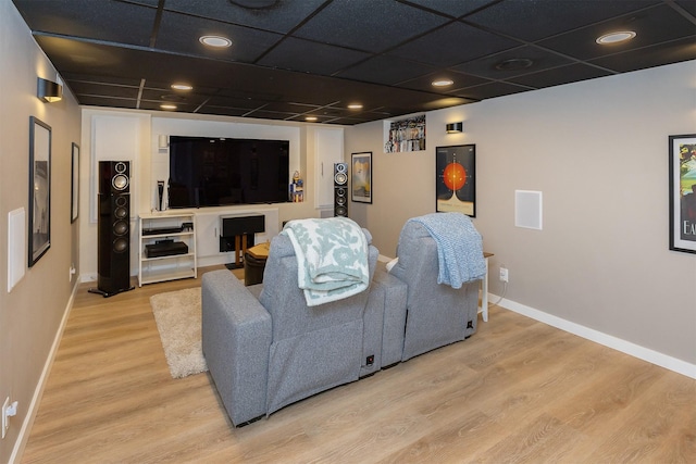 1346 48th St, Des Moines, IA 50311 - cinema room featuring wood finished floors and baseboards