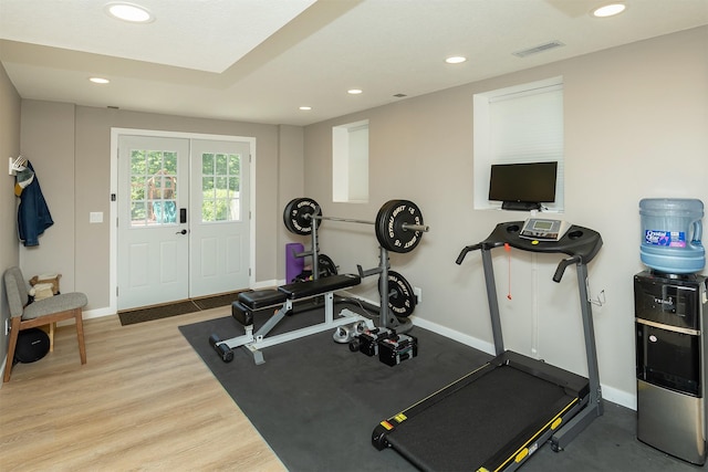 1346 48th St, Des Moines, IA 50311 - workout area featuring recessed lighting, wood finished floors, and french doors