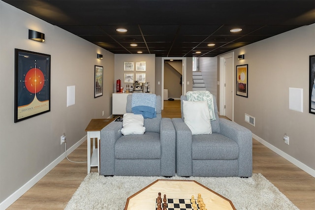 1346 48th St, Des Moines, IA 50311 - living area with wood finished floors, stairway, a drop ceiling, and recessed lighting