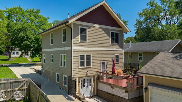 1346 48th St, Des Moines, IA 50311 - rear view of property with a wooden deck