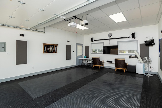 1346 48th St, Des Moines, IA 50311 - garage featuring electric panel and a garage door opener