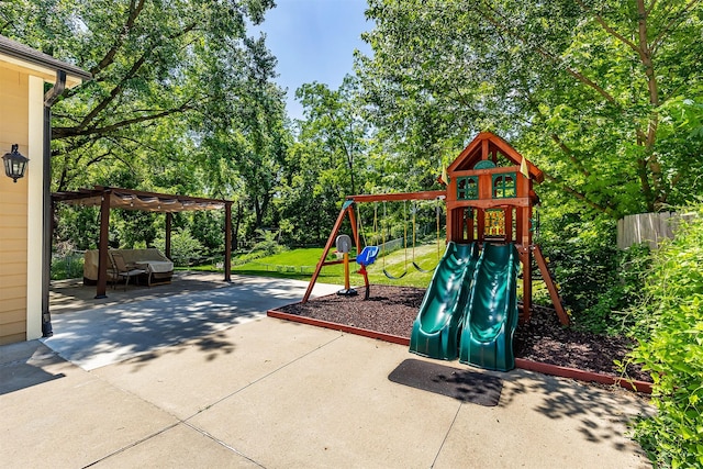1346 48th St, Des Moines, IA 50311 - view of jungle gym featuring a patio, a pergola, and view of scattered trees