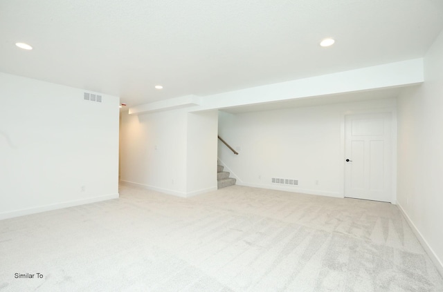 2410 NE 6th St, Grimes, IA 50111 - finished below grade area with recessed lighting, light carpet, and stairs