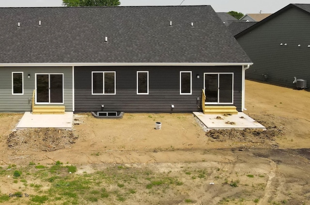2410 NE 6th St, Grimes, IA 50111 - back of house with entry steps and a shingled roof