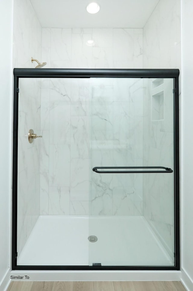 2410 NE 6th St, Grimes, IA 50111 - full bathroom with a marble finish shower