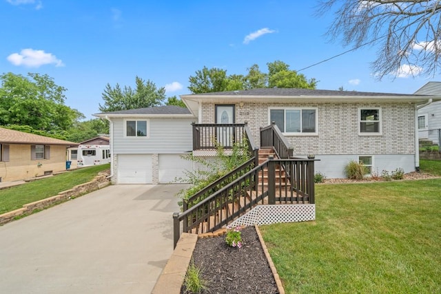 2560 E Sheridan Ave, Des Moines, IA 50317 - ranch-style home with brick siding, driveway, a front yard, and an attached garage