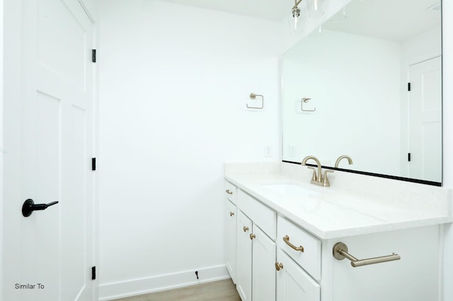2408 NE 6th St, Grimes, IA 50111 - bathroom with vanity and baseboards