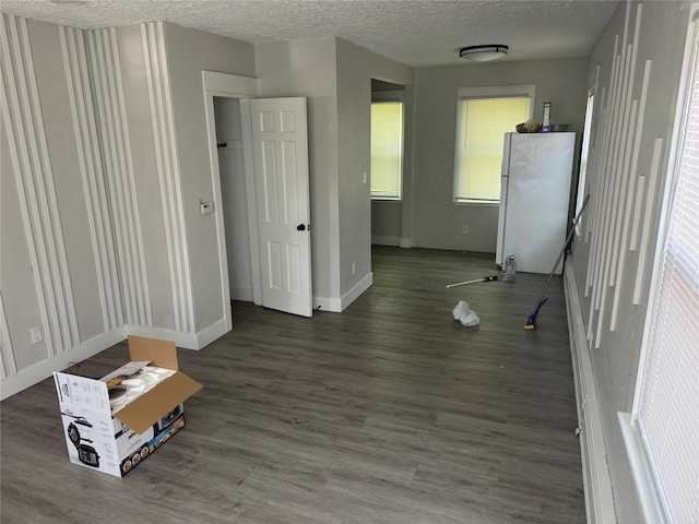 1008 Kingman Dr, Des Moines, IA 50311 - spare room featuring wood finished floors and a textured ceiling