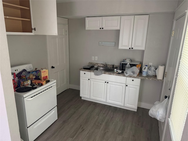 1008 Kingman Dr, Des Moines, IA 50311 - kitchen featuring white range with electric stovetop, dark wood-type flooring, and white cabinetry