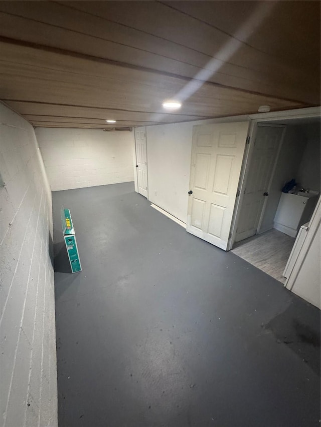 1008 Kingman Dr, Des Moines, IA 50311 - finished below grade area featuring concrete block wall and wooden ceiling