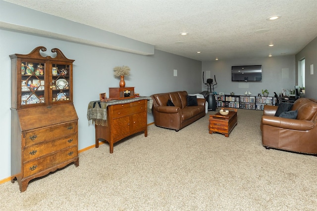 3540 E University Ave, Des Moines, IA 50317 - carpeted living room with a textured ceiling and recessed lighting