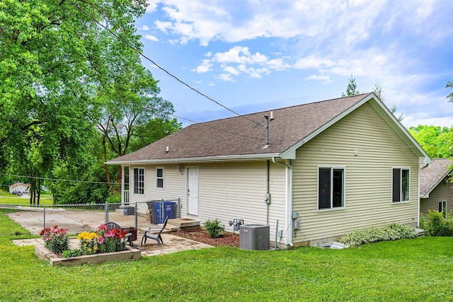 3540 E University Ave, Des Moines, IA 50317 - back of house featuring a patio area and roof with shingles