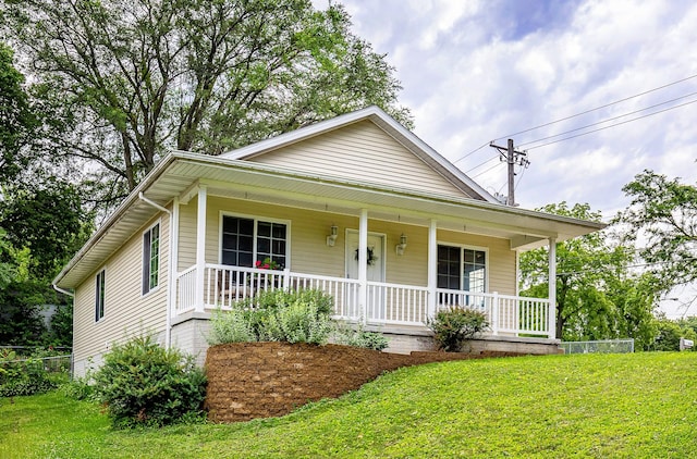 3540 E University Ave, Des Moines, IA 50317 - bungalow with a porch and a front yard