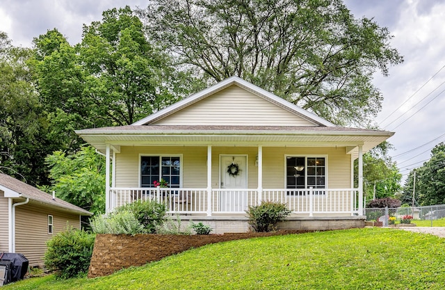 3540 E University Ave, Des Moines, IA 50317 - view of front of home with covered porch and a shingled roof
