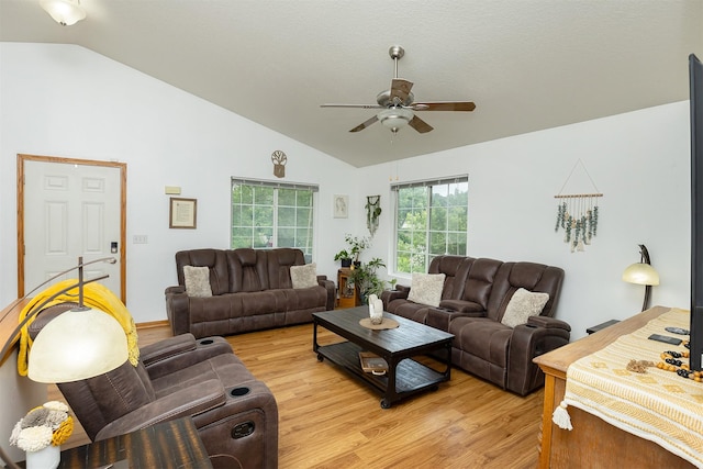 3540 E University Ave, Des Moines, IA 50317 - living room with vaulted ceiling, ceiling fan, and light wood-type flooring