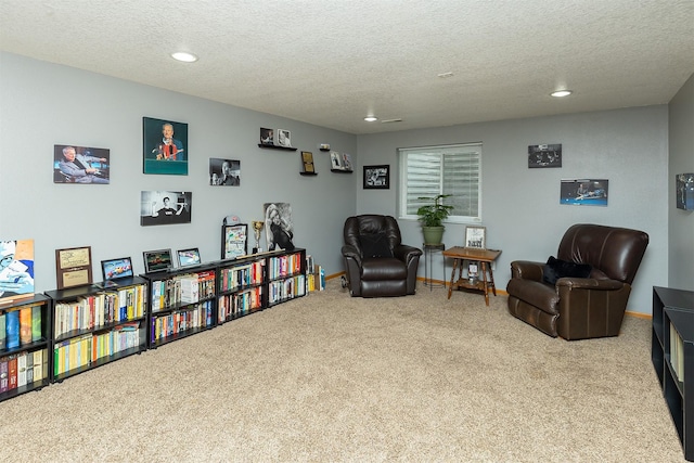 3540 E University Ave, Des Moines, IA 50317 - sitting room with carpet floors, recessed lighting, and a textured ceiling