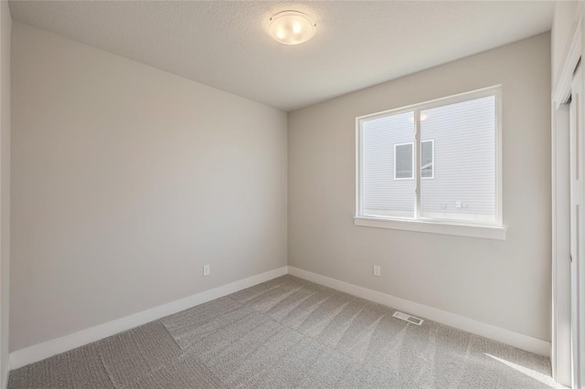 5610 Leyden Ave, Des Moines, IA 50317 - carpeted spare room featuring baseboards