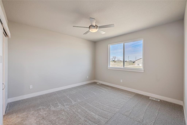 5610 Leyden Ave, Des Moines, IA 50317 - carpeted empty room featuring ceiling fan and baseboards