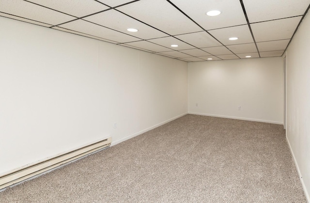 424/426 E Leach Ave, Des Moines, IA 50315 - spare room featuring baseboard heating, carpet flooring, and recessed lighting