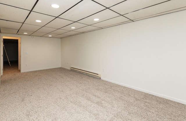 424/426 E Leach Ave, Des Moines, IA 50315 - empty room featuring a baseboard radiator, recessed lighting, and light carpet