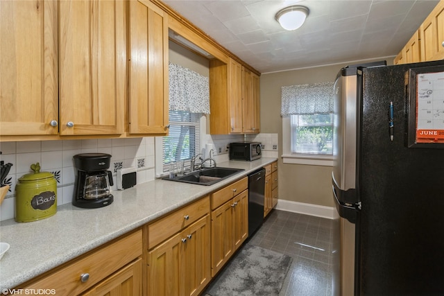 2730 53rd St, Des Moines, IA 50310 - kitchen featuring black appliances, plenty of natural light, backsplash, and light countertops