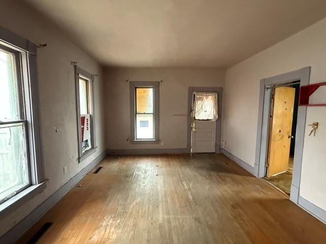 603 N 1st Ave, Marshalltown, IA 50158 - unfurnished living room with wood-type flooring