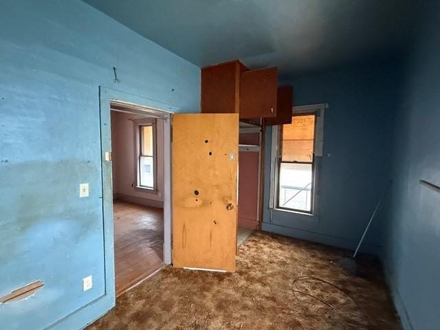 603 N 1st Ave, Marshalltown, IA 50158 - unfurnished bedroom featuring carpet flooring