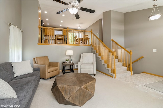 200 Walnut Dr NW, Bondurant, IA 50035 - carpeted living area with a ceiling fan, stairway, and recessed lighting