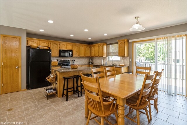 200 Walnut Dr NW, Bondurant, IA 50035 - dining space with recessed lighting and light tile patterned floors